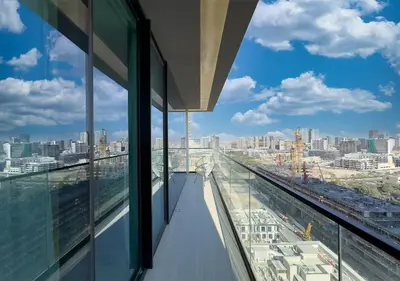 a view of the city from an office building at Brand New Luxurious 1 BR with Garden, Gym, Pool and Open View in Dubai