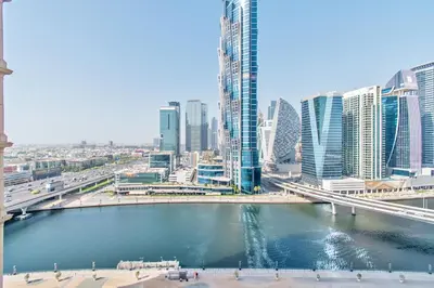 a view of a city with a river and buildings at DreamShoma-1BR Stunning Canal View in Dubai