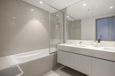 a bathroom with a tub and a sink and a shower at Mahogany 9 - 2BR 10PAX - Walk to Burj & Dubai Mall in Dubai