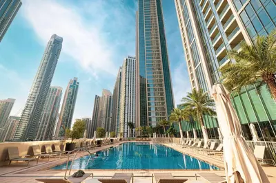 a swimming pool in a city with tall buildings at Mahogany 8 - 4BR 14PAX - Burj Khalifa View Central in Dubai
