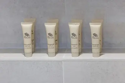 a group of fourorativeorative candles sitting on a shelf at Mahogany 8 - 4BR 14PAX - Burj Khalifa View Central in Dubai