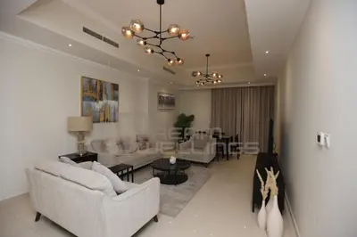 a living room with two couches and a table at Downtown Dunya Tower in Dubai