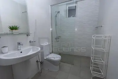 a bathroom with a shower and a sink and a toilet at Downtown Dunya Tower in Dubai