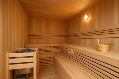 an empty sauna with wooden panels and a wooden at Burj Khalifa view studio apartment in Business bay, Downtown in Dubai