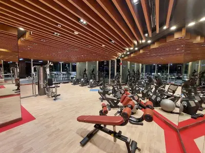 a gym with a lot of exercise equipment in a building at Burj Khalifa view studio apartment in Business bay, Downtown in Dubai