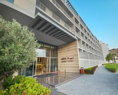 a building with a sign on the side of it at New 1 BR with 2 Balconies Near Circle Mall, Luma22 West Tower, JVC By Deluxe Holiday Homes in Dubai