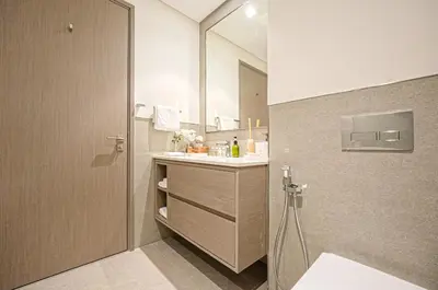 a bathroom with a sink and a mirror at Grande Signature Residences Luxury 3BR - Burj View in Dubai Downtown in Dubai