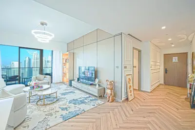 a living room with a couch and a fireplace at Grande Signature Residences Luxury 3BR - Burj View in Dubai Downtown in Dubai