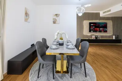 a dining room with a table and chairs at Near Beach Luxurious 2-Bedroom in JBR in Dubai