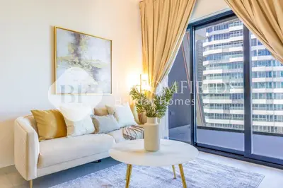 a living room with a couch and a table at Bloomfields Cozy 1Br In Binghatti Creek in Dubai