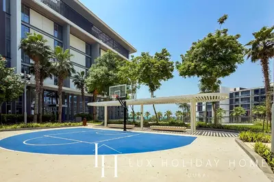 a basketball court in front of a building at LUX The Bluewaters Island Suite 2 in Dubai