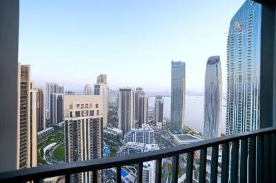 a view of a city from a balcony of a building at Comfortable 2BR Stay with Sea View in Dubai