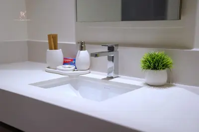 a bathroom sink with a plant sitting on top of it at Comfortable 2BR Stay with Sea View in Dubai
