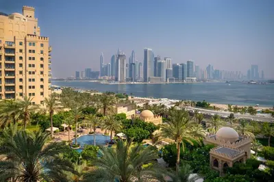 a view of the city of dubai from a resort at Luxury Fairmont Palm - Beach Access & Sea View in Dubai