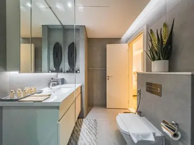 a bathroom with a sink and a toilet at TRPS - Ahad Residences, Business Bay - 1BR Luxurious Apartment - Massive Balcony with Pool View in Dubai