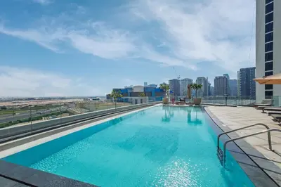 a swimming pool on the roof of a building at Contemporary 1BR Prime Location with Parking in Dubai