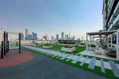 a rooftop of a building with a view of a city at Celestial View 1BR apartment in JVC in Dubai