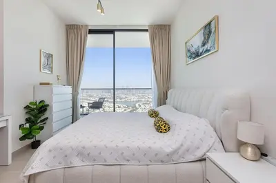 a bedroom with a bed with a leopard head on it at Celestial View 1BR apartment in JVC in Dubai