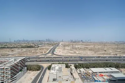 an aerial view of a construction site with a highway at Modern JVC Apartment Views of Marina Skylines in Dubai