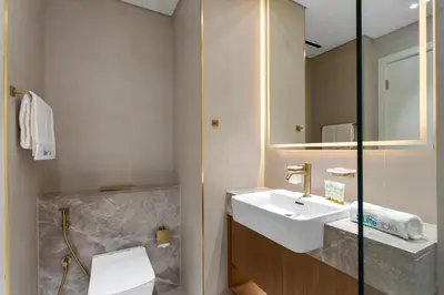 a bathroom with a sink and a toilet at Stylish Studio with Jacuzzi in Business Bay in Dubai
