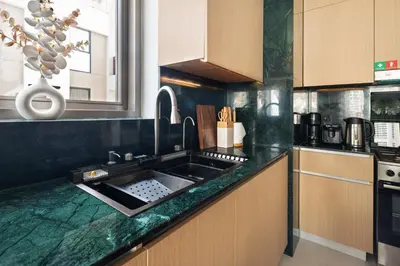 a kitchen with a sink and a counter top at qua Serenity Poolside with Community Views in Dubai
