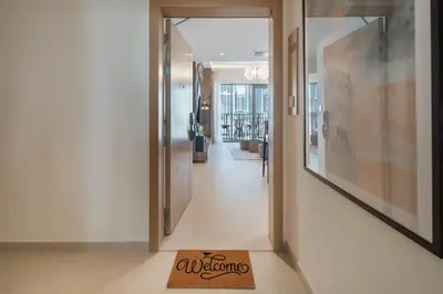 a welcome mat on the floor of a hallway at qua Serenity Poolside with Community Views in Dubai
