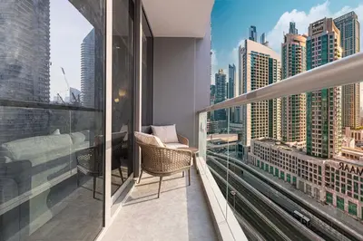 a balcony with a view of a city skyline at Luxe 1BR Burj View 10 min Walk to Dubai Mall in Dubai