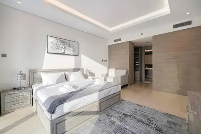 a bedroom with a large bed in a room at Luxe 1BR Burj View 10 min Walk to Dubai Mall in Dubai