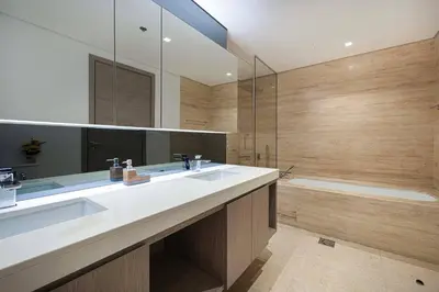 a bathroom with a large sink and a tub at Luxe 1BR Burj View 10 min Walk to Dubai Mall in Dubai