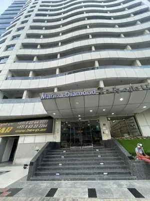 a large building with stairs in front of it at Diamond Studio Marina in Dubai