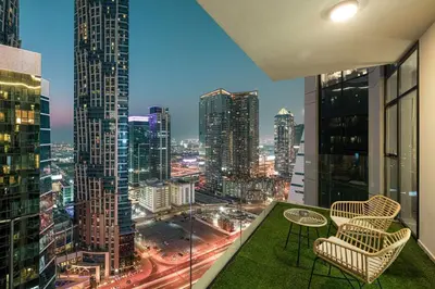 a balcony with a view of a city skyline at Mahogany 10 - 2BR 8 PAX - Infinity Pool & Modern in Dubai