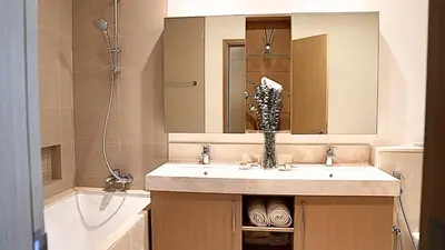 a bathroom with a sink and a mirror and a tub at Luxe Dubai Marina Apartment 5242 Building 2bhk in Dubai
