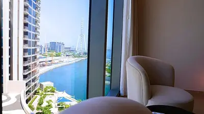 a room with a window with a view of the water at Luxe Dubai Marina Apartment 5242 Building 2bhk in Dubai