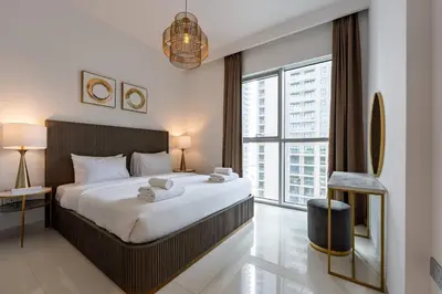 a bedroom with a large bed and a large window at TRPS - Beach Isle Tower 1, Dubai Harbour - 1BR Premium Beachfront - Private Beach Access in Dubai