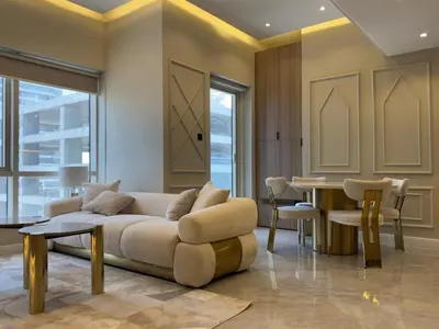 a living room with a couch and a table at A unique luxury touch in JLT in Dubai