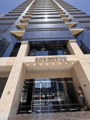a building with a sign on the front of it at A unique luxury touch in JLT in Dubai