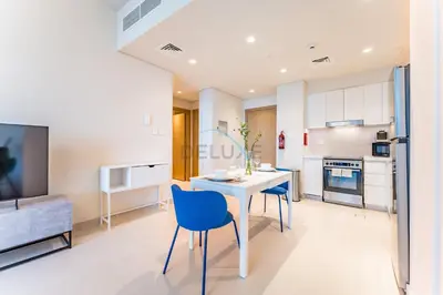 a kitchen with a table and chairs in a room at High-Rise 1BR with Stunning Creek Views,Near to Dubai Creek Tower Viewpoint, Harbour Gate Tower 2, Dubai Creek Harbour by Deluxe Holiday Homes in Dubai
