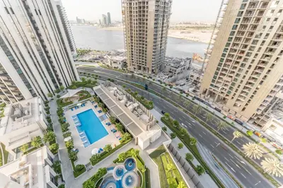 an aerial view of a city with tall buildings at High-Rise 1BR with Stunning Creek Views,Near to Dubai Creek Tower Viewpoint, Harbour Gate Tower 2, Dubai Creek Harbour by Deluxe Holiday Homes in Dubai