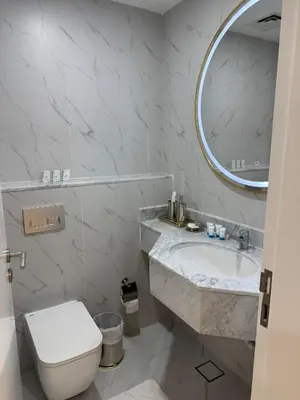 a bathroom with a sink and a toilet and a mirror at Icon tower 1 , JLT 1BHK apartment in Dubai
