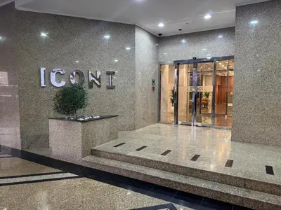 a entrance to a store with a sign on the wall at Icon tower 1 , JLT 1BHK apartment in Dubai