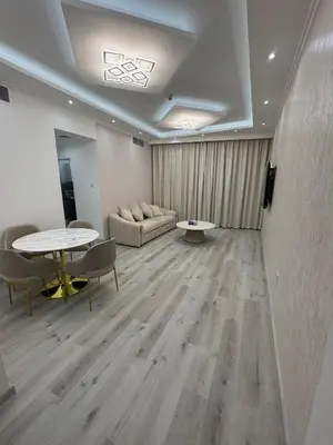 a living room with a couch and a table at Icon tower 1 , JLT 1BHK apartment in Dubai