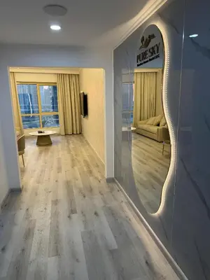 a hallway with a mirror and a living room at Icon tower 1 , JLT 1BHK apartment in Dubai