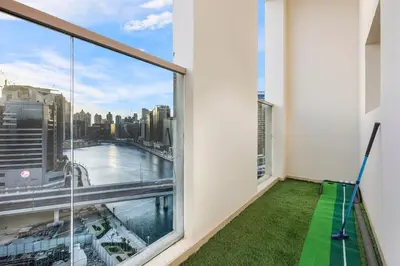 a balcony with a view of the city at FIRST CLASS 2BR Sleek Urban Oasis in Dubai