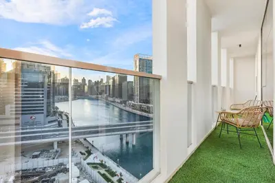 a balcony with a view of the city at FIRST CLASS 2BR Sleek Urban Oasis in Dubai