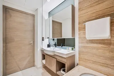 a bathroom with a sink and a mirror at Vibrant&Chic - Studio - 6MN Dubai Mall - Pool&Gym in Dubai