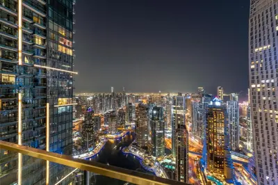 a city skyline at night with tall buildings at 1BR Jumeirah Living - Marina View - 5 STARS Facilities in Dubai