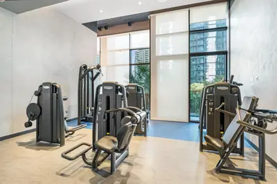 a gym with treadmills and elliptical machines at 1BR Jumeirah Living - Marina View - 5 STARS Facilities in Dubai