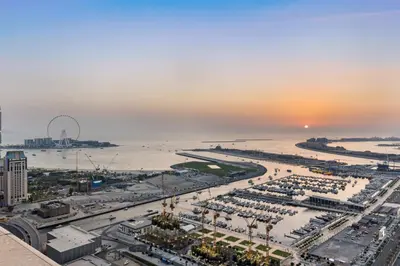an aerial view of a city with the ocean at Stylish 2BR in Elite Tower with Bluewaters View and JBR in Dubai