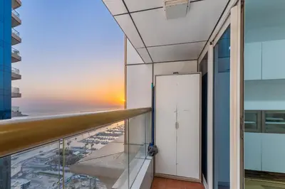 a view of the ocean from the balcony of a building at Stylish 2BR in Elite Tower with Bluewaters View and JBR in Dubai