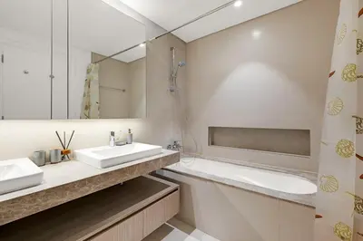 a bathroom with a sink and a tub and a mirror at Luxurious, Creek & Marina View in Dubai